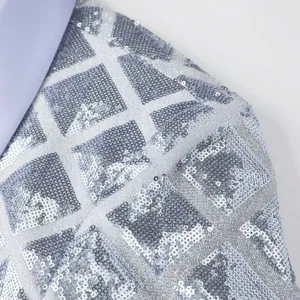 Close-up detail of men's silver sequin blazer featuring geometric grid pattern and collar.