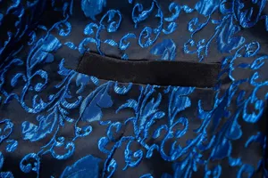 Close-up detail of men's blue and black jacquard suit jacket fabric with refined pocket trim.