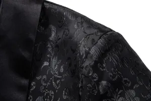 Close-up detail of men black jacquard suit jacket shoulder and satin shawl lapel.