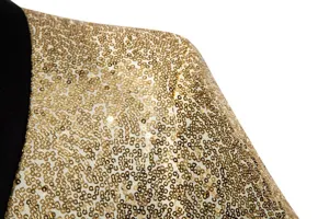 Men's gold sequin blazer shoulder detail closeup, luxury shiny party suit jacket fabric.