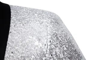 Men's sequin suit jacket detail close-up showing sparkling silver sequins and black lapel.