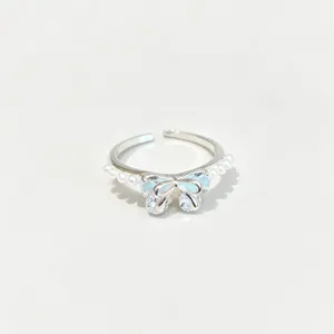 Anillo abierto plateado estilo coreano con circonita lazo azul y perlas joya moda