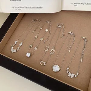 Silver chain bracelet set featuring cute heart, clover and butterfly charms for daily stacking.