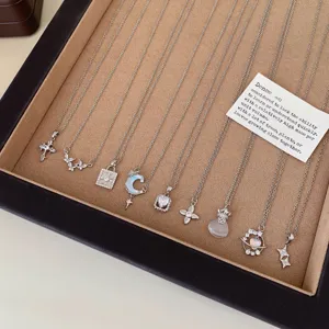 Silver delicate necklace collection featuring star, moon and diamond pendants for daily wear.