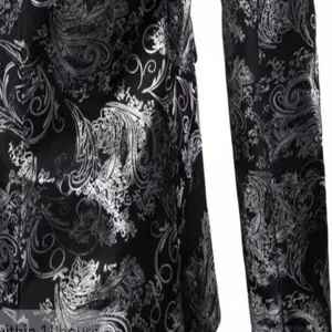 Close-up view of the black and silver paisley suit jacket showing intricate fabric details.