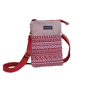 Close-up detail of the red ethnic style fabric crossbody phone bag with geometric patterns.