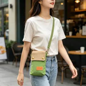 Green canvas crossbody phone bag for women, minimalist lightweight fabric shoulder pouch.