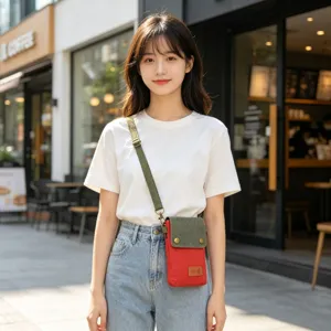 Canvas crossbody phone bag in red and green color with adjustable strap details for daily use.