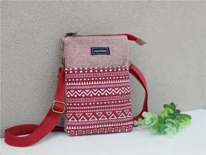 Close-up detail view of red ethnic pattern multi-layer cross-body mobile phone bag.