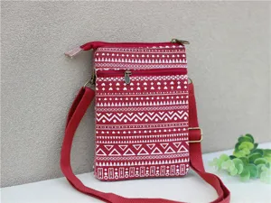 Ethnic style red fabric crossbody phone bag featuring multi-layer zippers and strap.