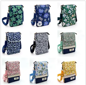 Floral fabric crossbody phone bag featuring multi-layer compartments and adjustable strap.