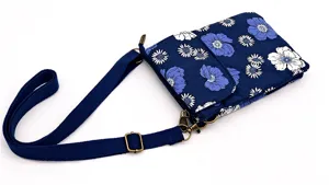 Blue floral crossbody phone bag detail with adjustable strap and durable vintage hardware.