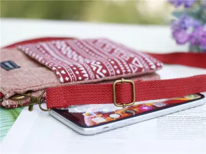 Ethnic style canvas cross-body phone bag with multi-layer design and adjustable strap.