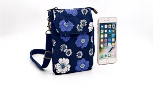 Floral fabric crossbody phone bag detail, blue small shoulder pouch with adjustable strap.