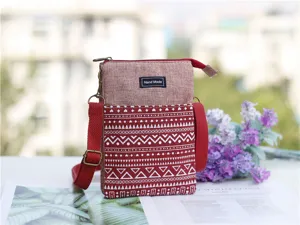 Red canvas crossbody phone bag with ethnic print, multi-layer design, detailed view.