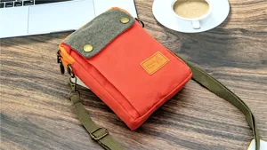 Canvas crossbody phone bag for women, multi-layer casual shoulder bag with vibrant contrast colors.