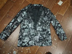 Men's fashion black suit jacket with silver paisley pattern and satin lapel, stylish blazer.
