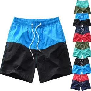 Short de plage décontracté et colorblock pour homme avec taille élastique à cordon.