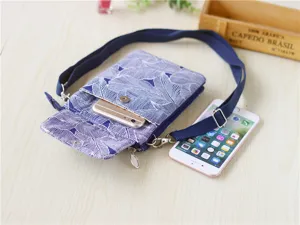 Blue and white leaf pattern crossbody phone bag with multi-layer storage and adjustable strap.