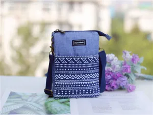 Ethnic style canvas crossbody phone bag featuring geometric white patterns and adjustable shoulder strap.