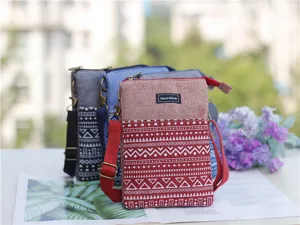 Ethnic style canvas cross-body phone bag with multi-layer design and adjustable strap.