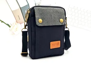 Small canvas cross-body phone bag for women, casual multi-layer mini shoulder bag detail view.