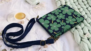 Detailed view of pastoral floral crossbody phone bag with adjustable strap and aesthetic design.