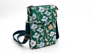 Floral fabric crossbody phone bag detail view with green floral print and adjustable strap.