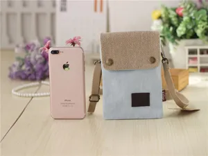 Casual denim canvas mini crossbody phone bag with snap closure and adjustable strap.