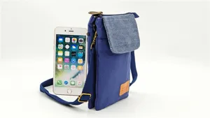 Blue canvas crossbody phone bag, multi-layer shoulder pouch with front flap and strap.