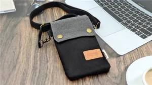 Mini canvas crossbody phone bag, lightweight black fabric mobile pouch with adjustable strap.