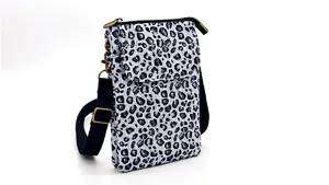 Detailed view of the stylish fabric crossbody phone bag featuring a trendy leopard print pattern.