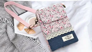 Fresh pastoral floral fabric cross-body phone bag with denim and lace design for women.