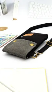 Minimalist canvas crossbody phone bag with multi-layer design, lightweight and stylish.