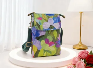 Detailed view of the floral fabric crossbody phone bag featuring elegant flower print.