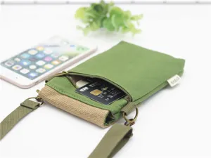 Solid color canvas three-layer crossbody phone bag, minimalist fabric lightweight design.
