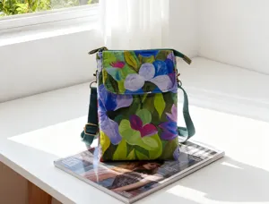 Floral fabric crossbody phone bag detail view, casual mini shoulder bag with adjustable strap.