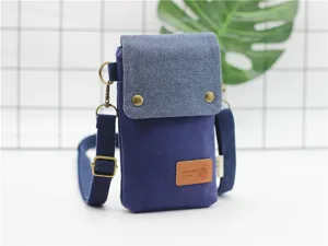 Blue canvas crossbody phone bag, stylish minimalist lightweight shoulder bag for daily use.