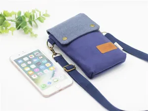 Blue canvas crossbody phone bag with multiple layers, compact and lightweight design for daily use.
