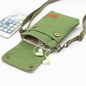 Solid green canvas crossbody phone bag with adjustable strap, lightweight design.
