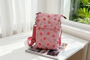 Pink canvas crossbody phone bag with cute fruit print, casual daily shoulder bag for women.
