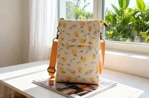 Fresh pastoral style floral fabric crossbody phone bag with cute orange print detail view.