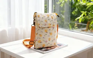 Fresh pastoral fabric crossbody phone bag with cute orange print, adjustable strap, daily use.