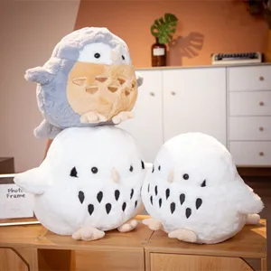 Detail shot of cute round owl plush toys set, soft stuffed animal doll pillow for kids gifts.