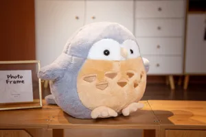 Cute stuffed owl plush toy detail shot showing soft plush material and round shape.