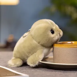 Cute seal plush toy keychain detail shot, soft fabric and realistic design for bag decoration.