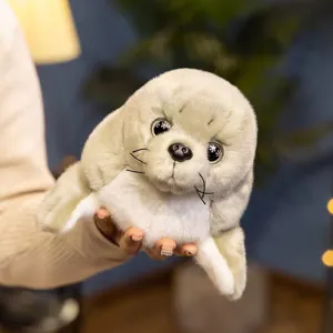 Close-up detail of a realistic grey seal plush toy, soft stuffed animal toy gift.