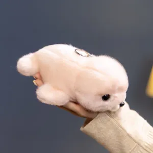 Cute plush seal toy keychain, soft white stuffed animal pendant for bags and car keys.