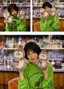 Cute penguin plush toy with knit scarf and hat, soft stuffed animal doll for kids and girls.