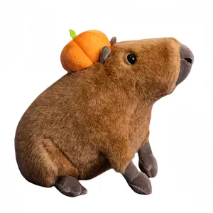 Cute sitting capybara plush toy with cute pumpkin back design, soft stuffed animal doll.
